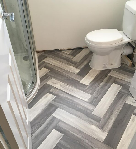 an image of the herringbone style laminate flooring in bathroom