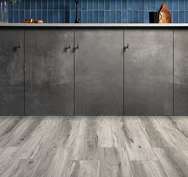 an image of some grey laminate flooring alongisde grey kitchen cupboards