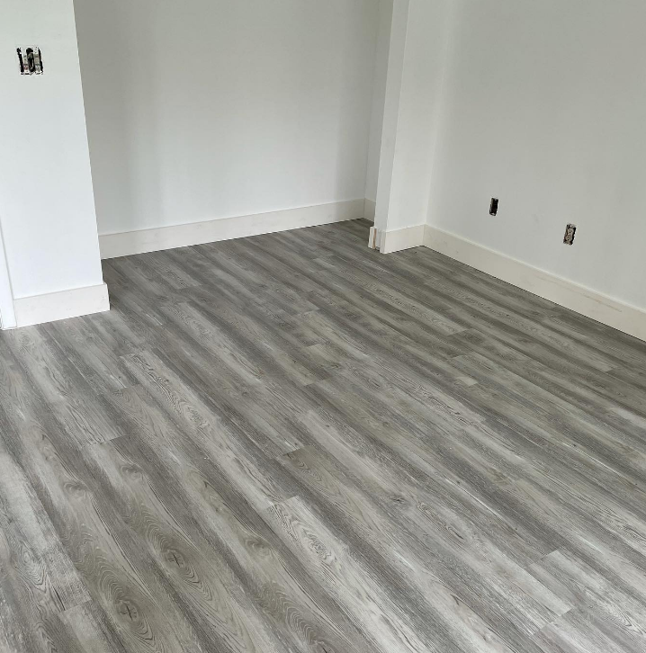 an image of grey painted vinyl flooring, with white walls
