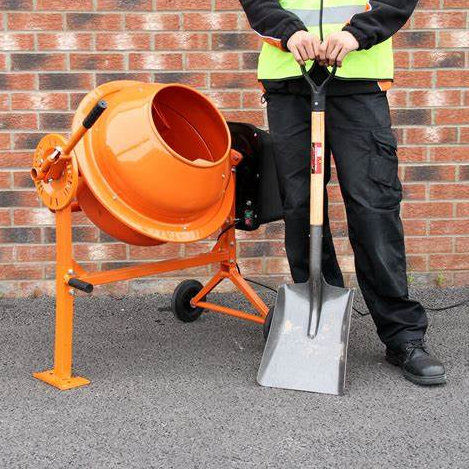 an image of an electric cement mixer and man in hi vis jacket