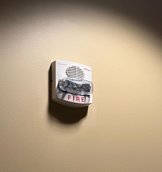 an image of a fire alarm on beige wall 