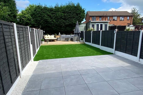 a modern painted fence in customer garden