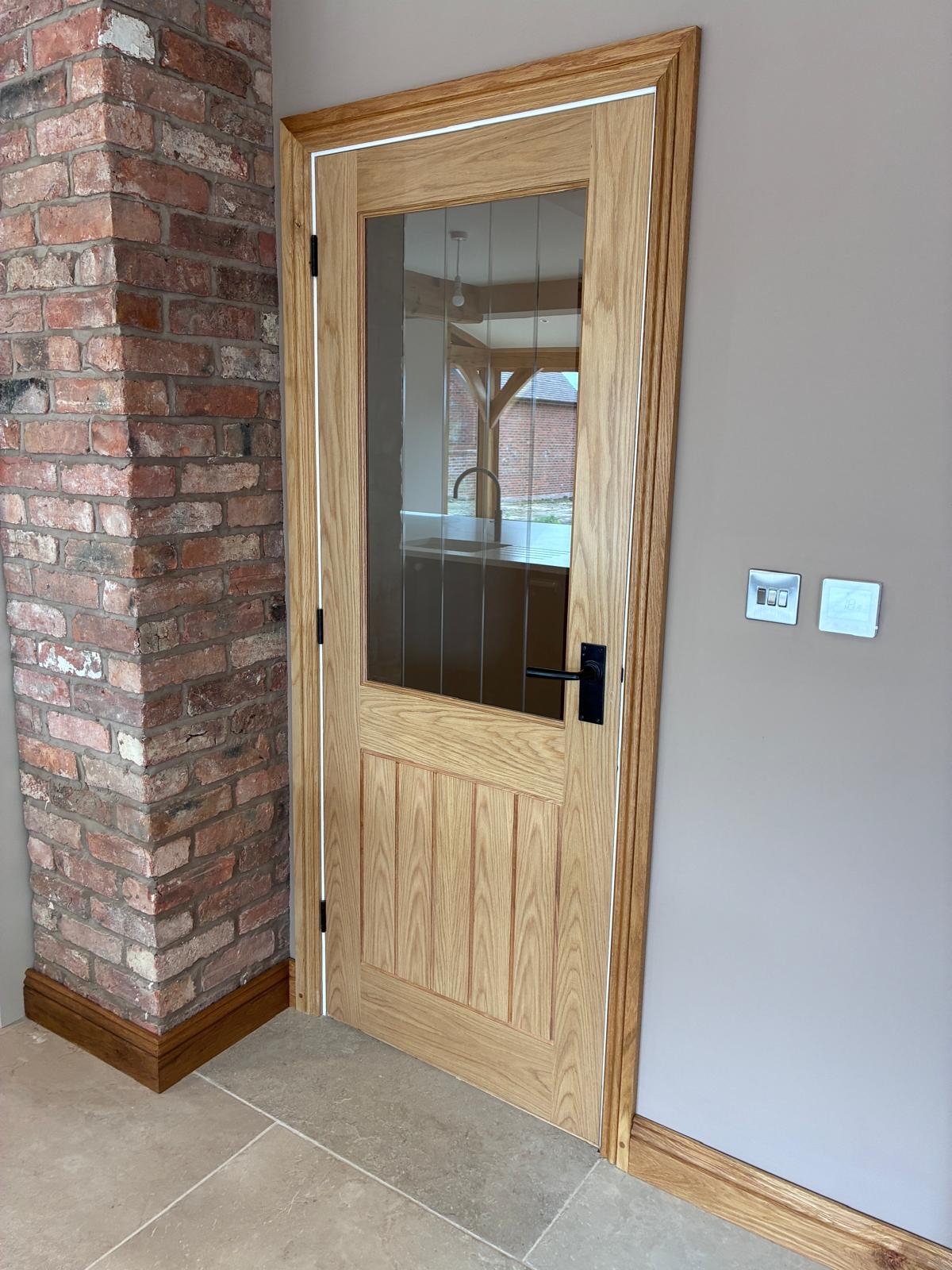 An image of the Deanta Ely door in the kitchen. An image of the Deanta Ely door in the kitchen.