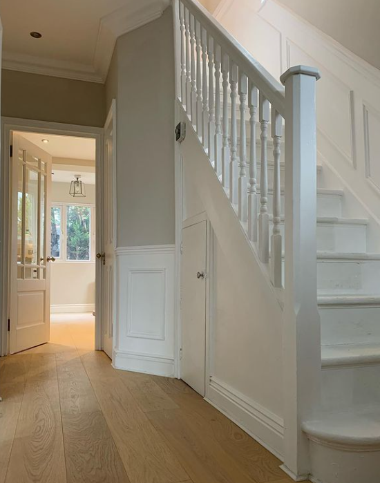 an image of a white staircase in home with white scotia beading
