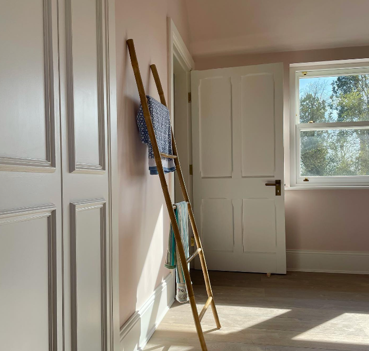 an image of white scotia beading in pink room with white door