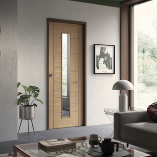 An image showing a palermo Original Pre-Finished 1 Light Internal Oak Door with Clear Glass in a living room. Grey sofa on the right with a floor to ceiling window.